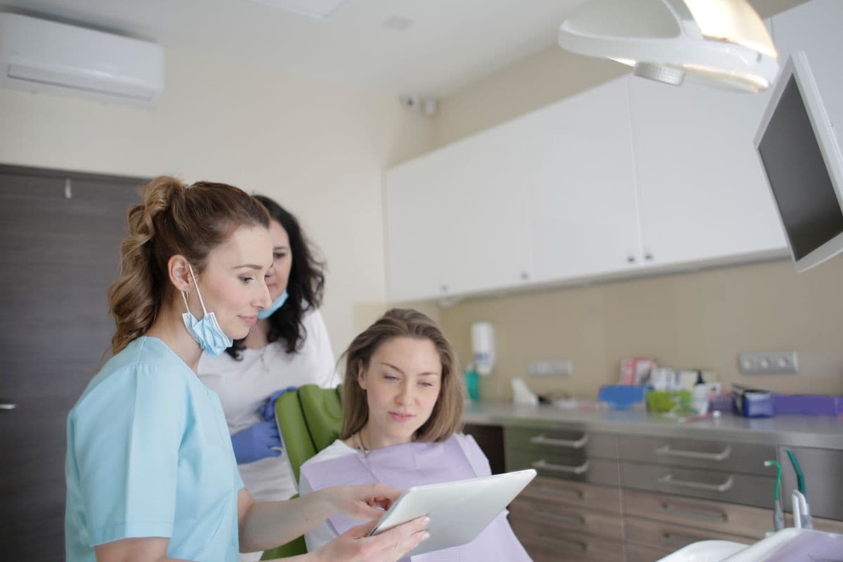Dental team reviewing a treatment plan with a patient